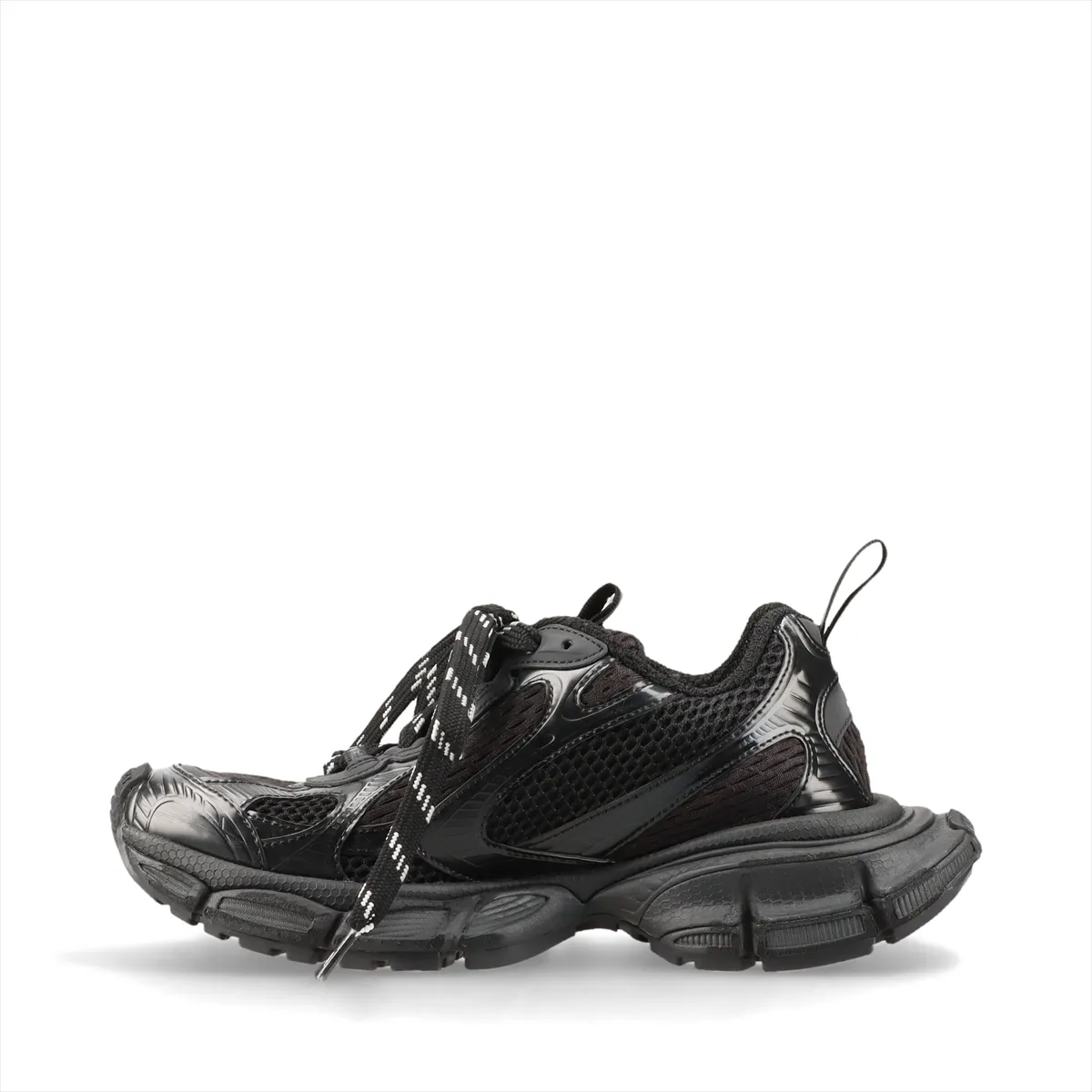 Oversized black chunky sneaker with mesh panels and a thick heavily textured sole.