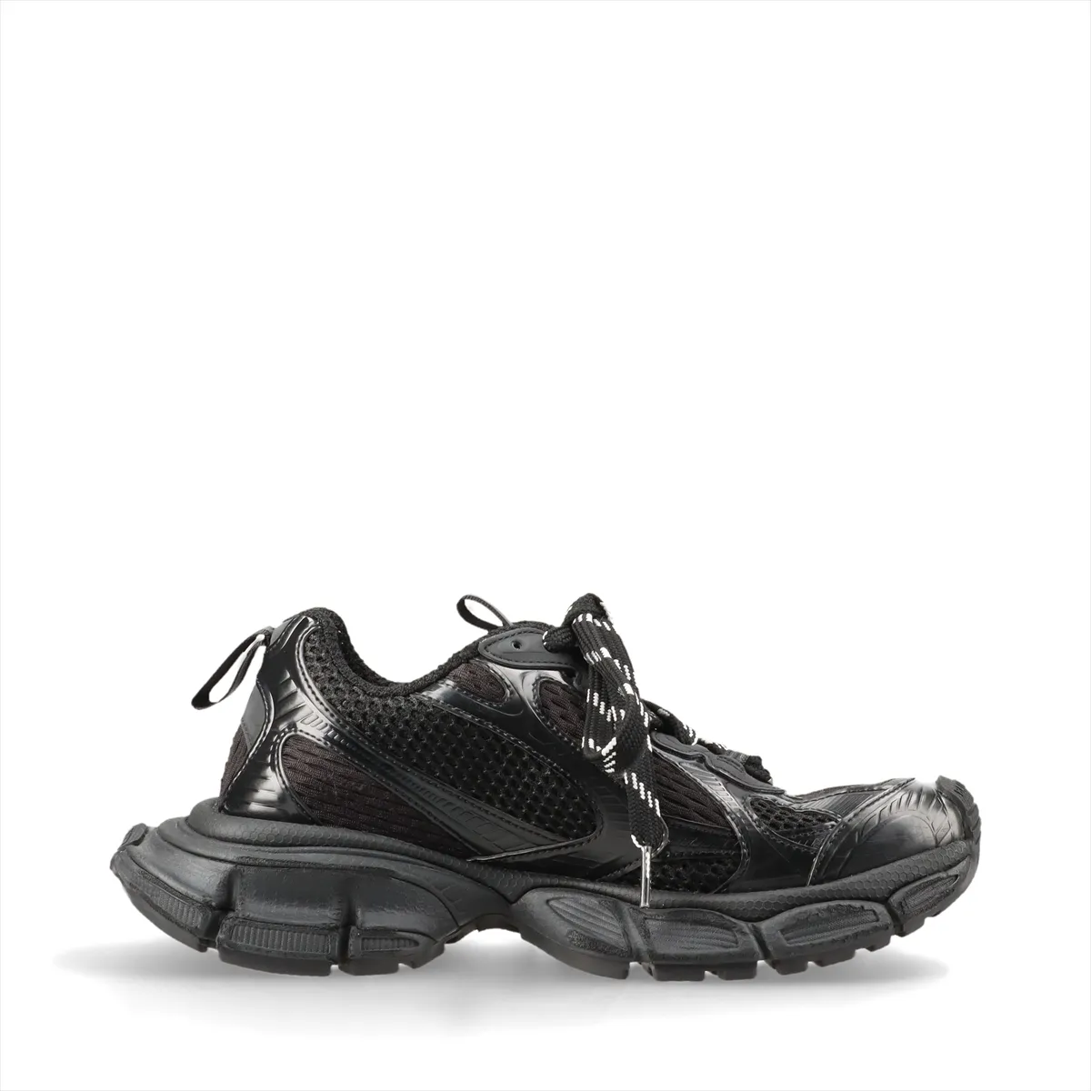 Oversized black chunky sneaker with mesh panels and a thick heavily textured sole.