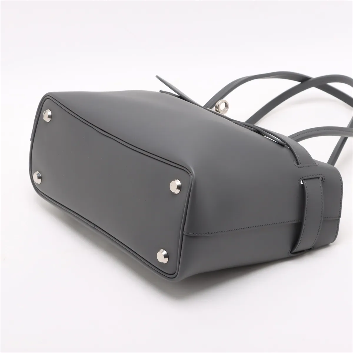 Structured grey leather tote bag with twin handles and a hanging key holder.