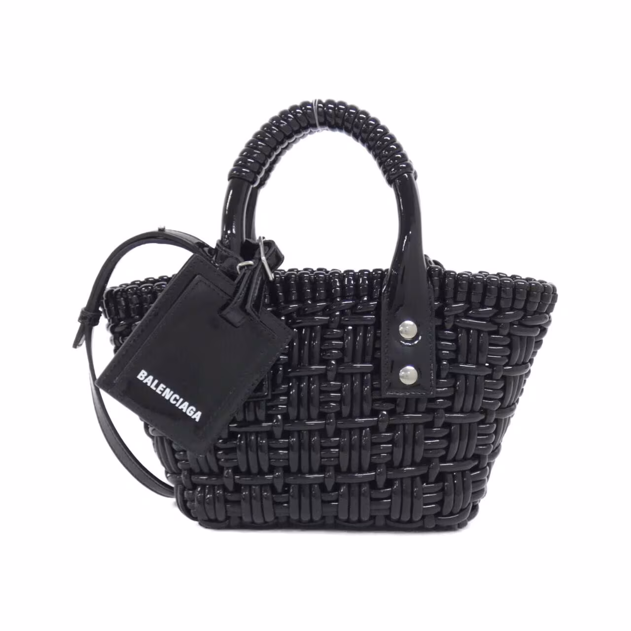 Small woven basket-style bag with a top handle and front logo detail.