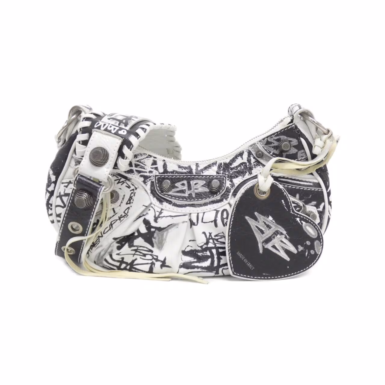 Slouchy shoulder bag with studded hardware, buckle strap and graffiti-style printing.