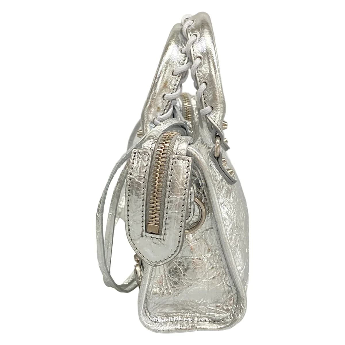 Very small metallic silver handbag with twin rolled handles and zip closure.