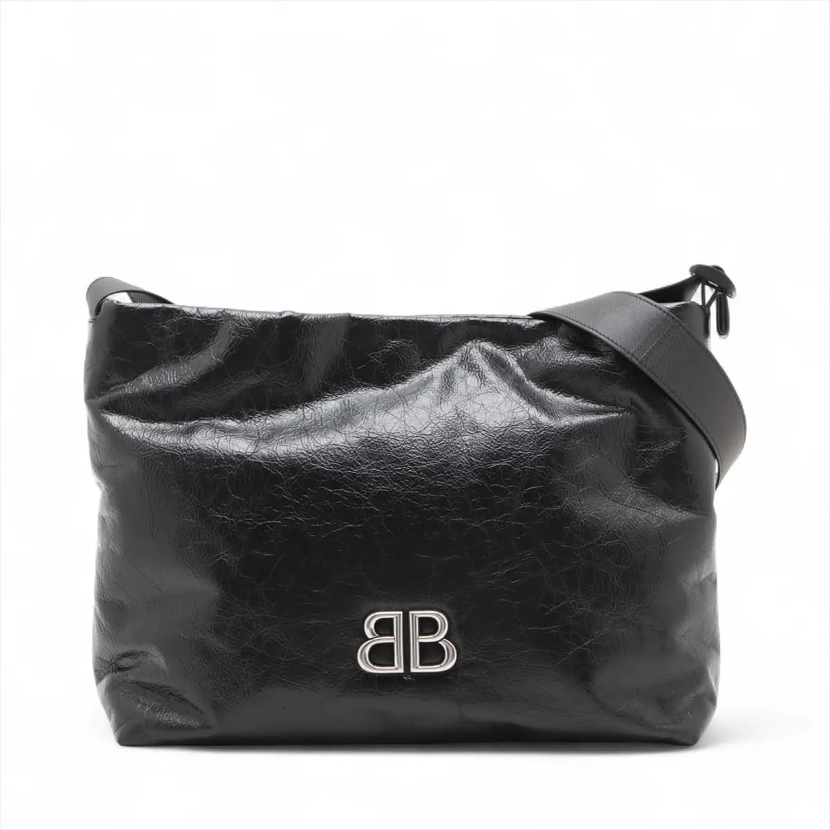 Black leather shoulder bag with chain strap and metal closure at the front flap.