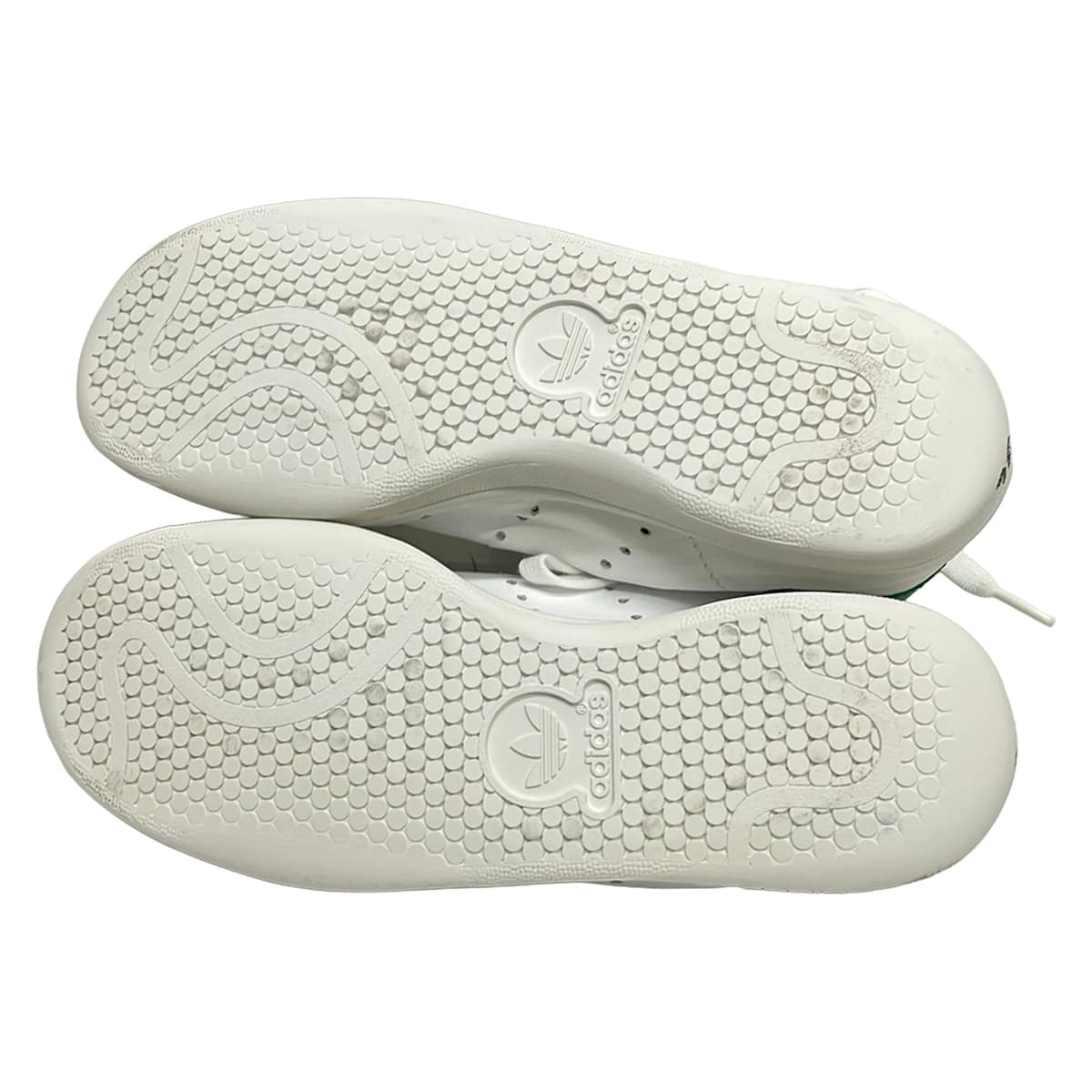 Low-top lace-up shoe photographed on a plain background.