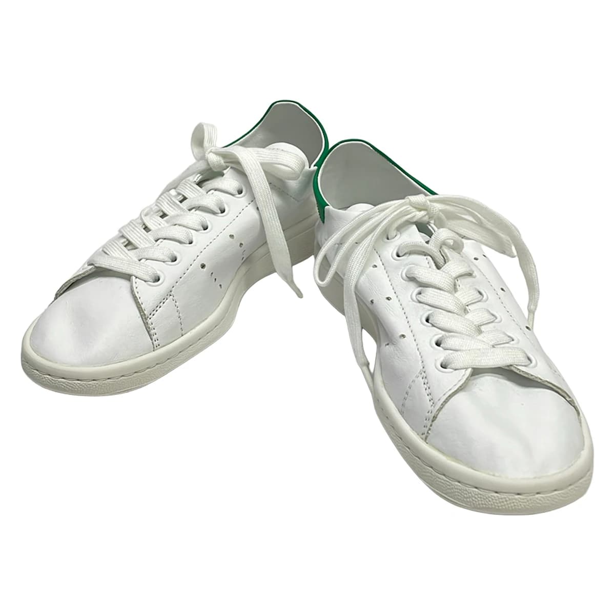Low-top lace-up shoe photographed on a plain background.