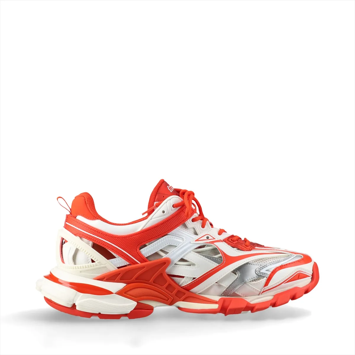 Chunky layered low-top sneakers in white with orange panels and mesh sections, shown in profile.