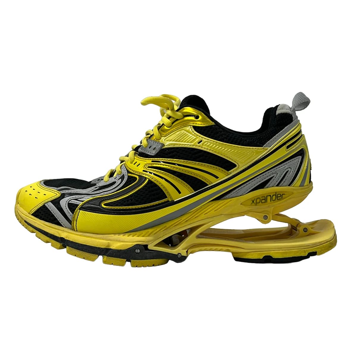 Chunky exaggerated-sole trainers in a dark tone, shown from the side.