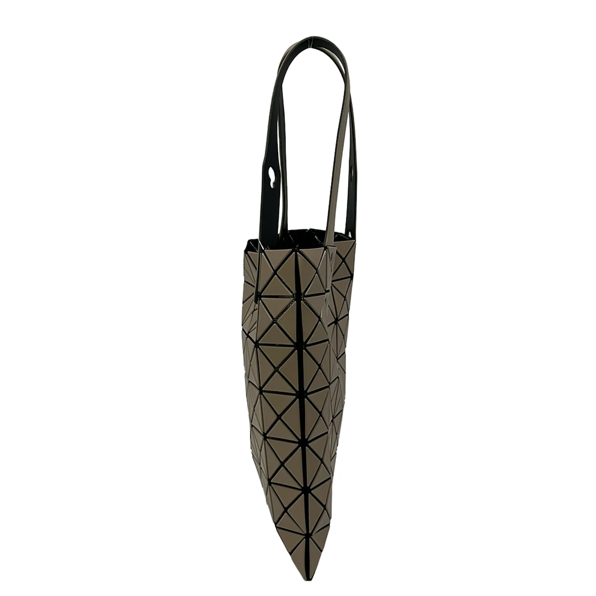 Tote bag built from geometric triangular panels in beige and black.