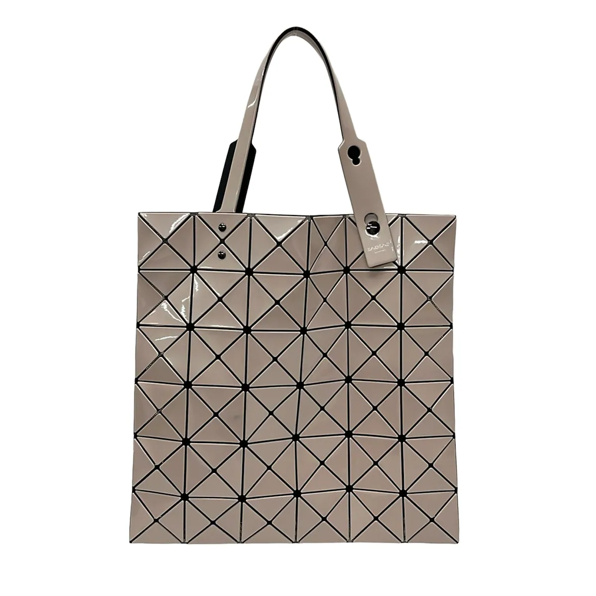 Beige tote bag made of geometric triangular panels with two shoulder handles.