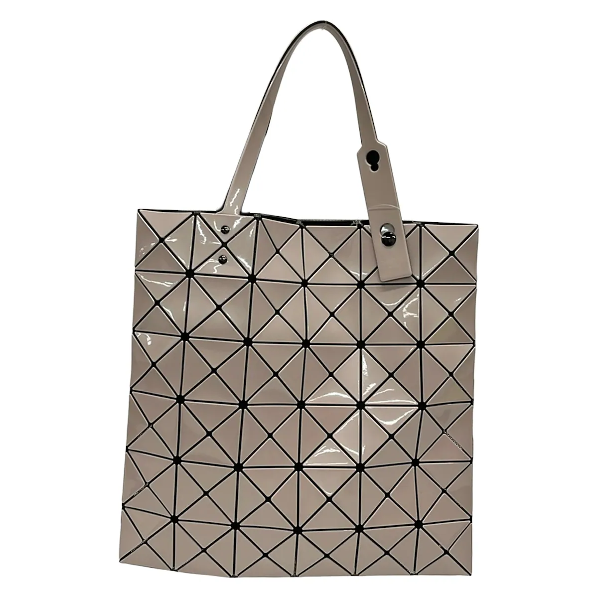 Beige tote bag made of geometric triangular panels with two shoulder handles.