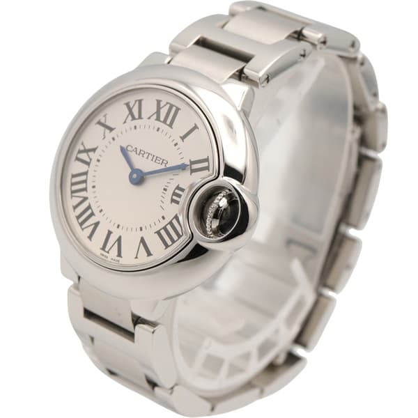Product photograph of a round steel watch with a blue cabochon crown on a steel bracelet.