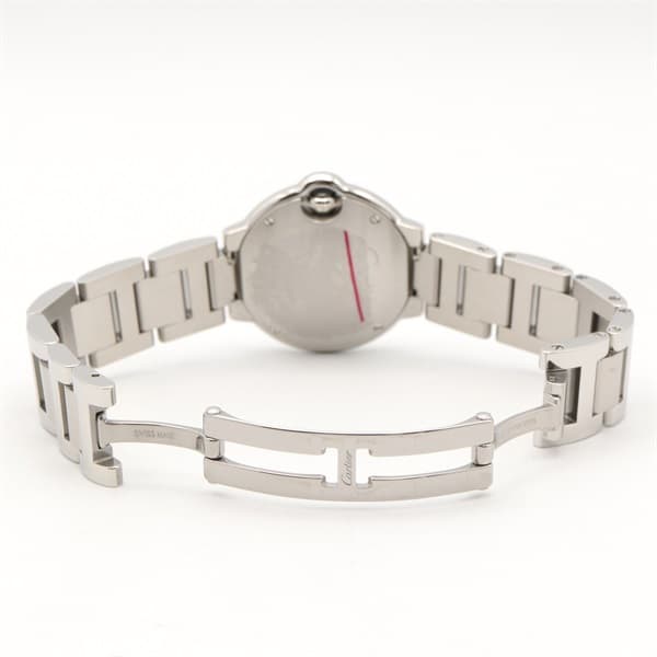 Product photograph of a round steel watch with a blue cabochon crown on a steel bracelet.