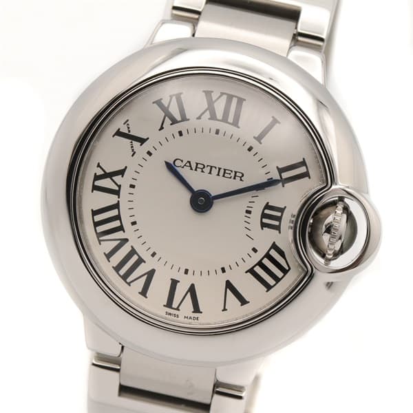 Product photograph of a round steel watch with a blue cabochon crown on a steel bracelet.