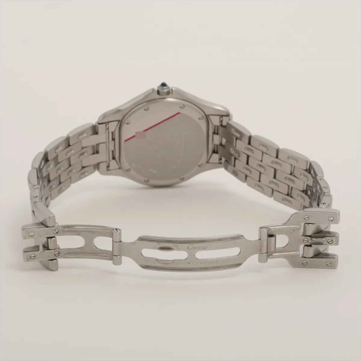 Steel watch with rounded case, ivory dial, Roman numerals and a flat link bracelet.