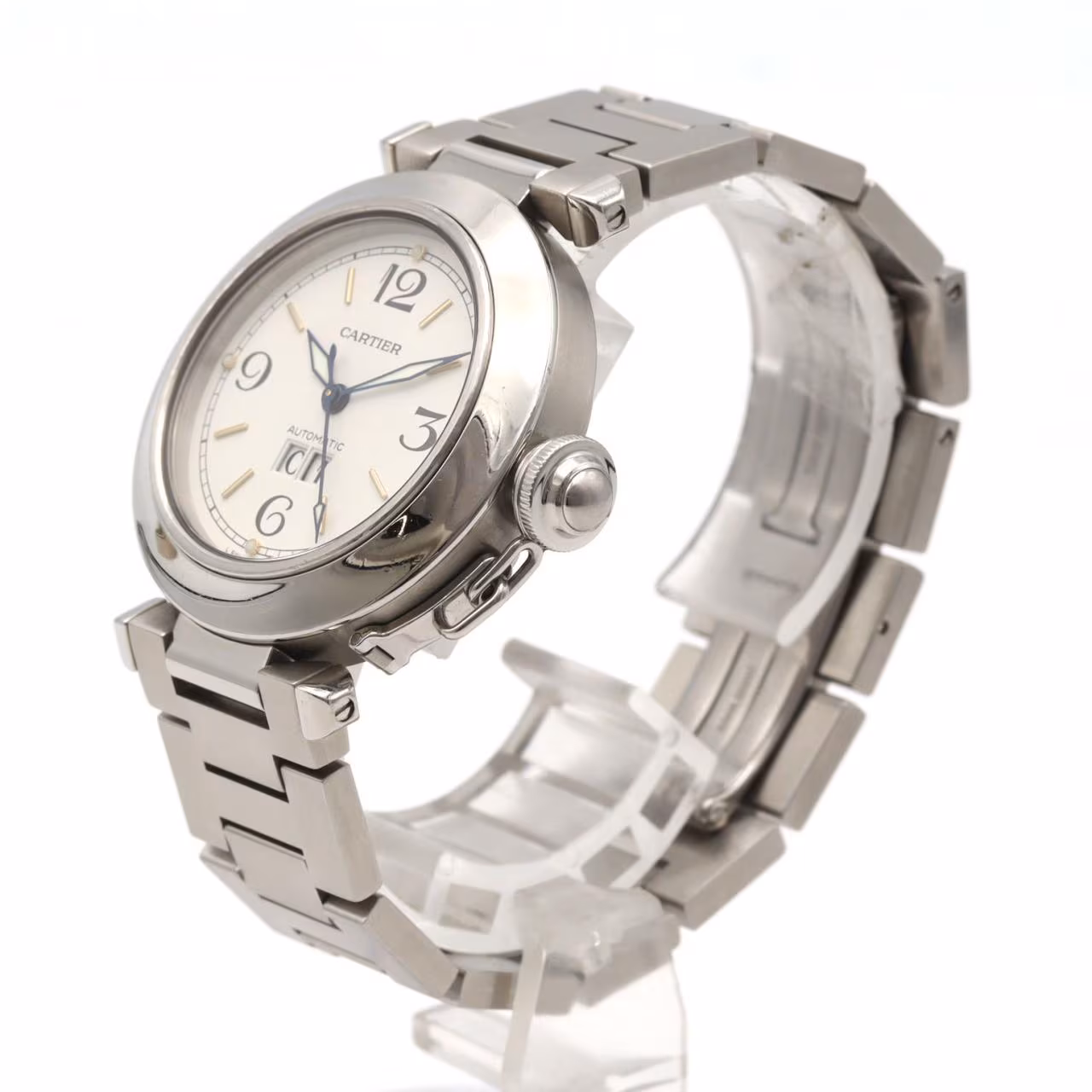 Round steel watch with large date aperture, chained crown cover and steel bracelet.