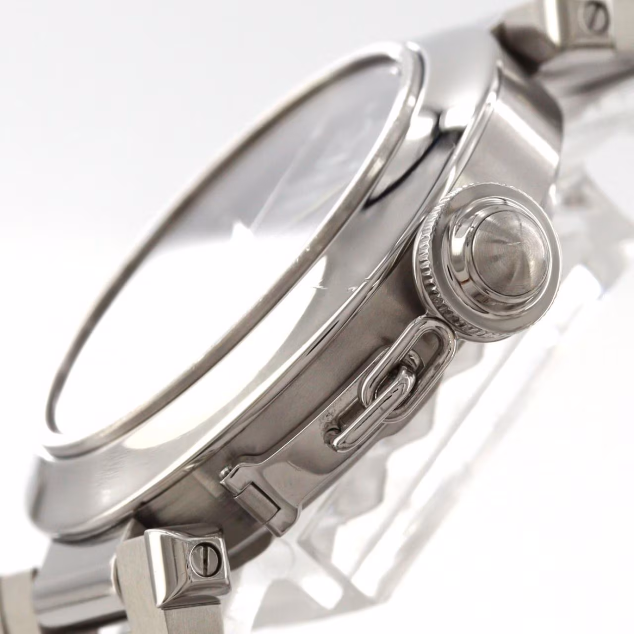 Round steel wristwatch with a screw-down crown cap and large date display.