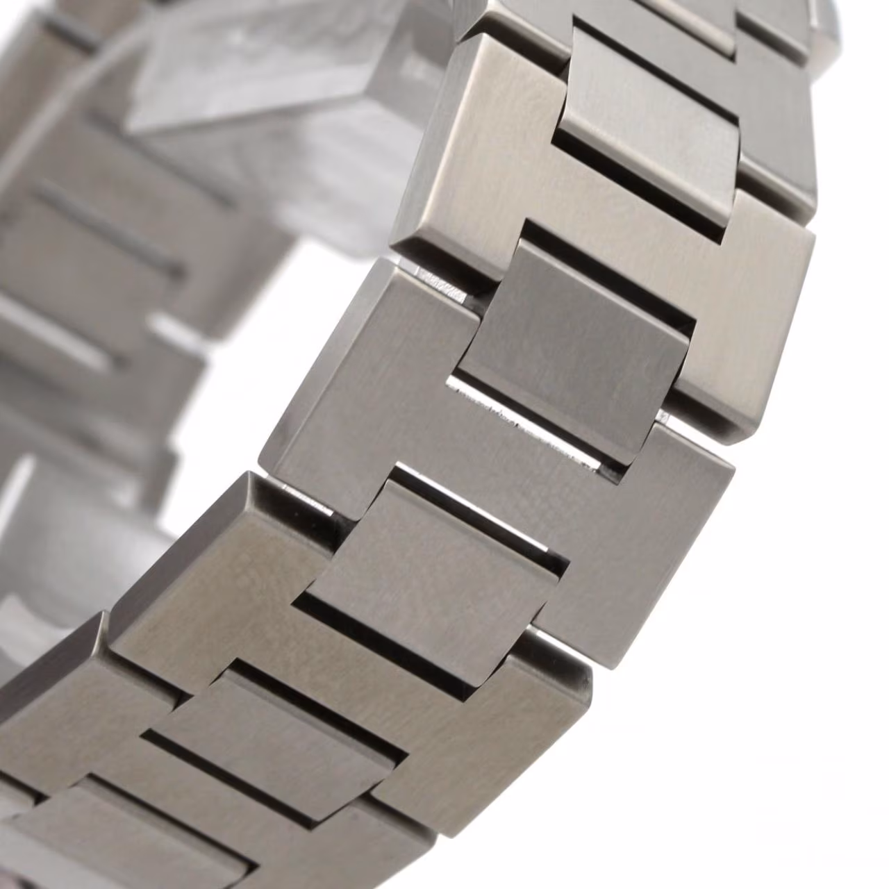 Round steel watch with Arabic numerals and steel bracelet.