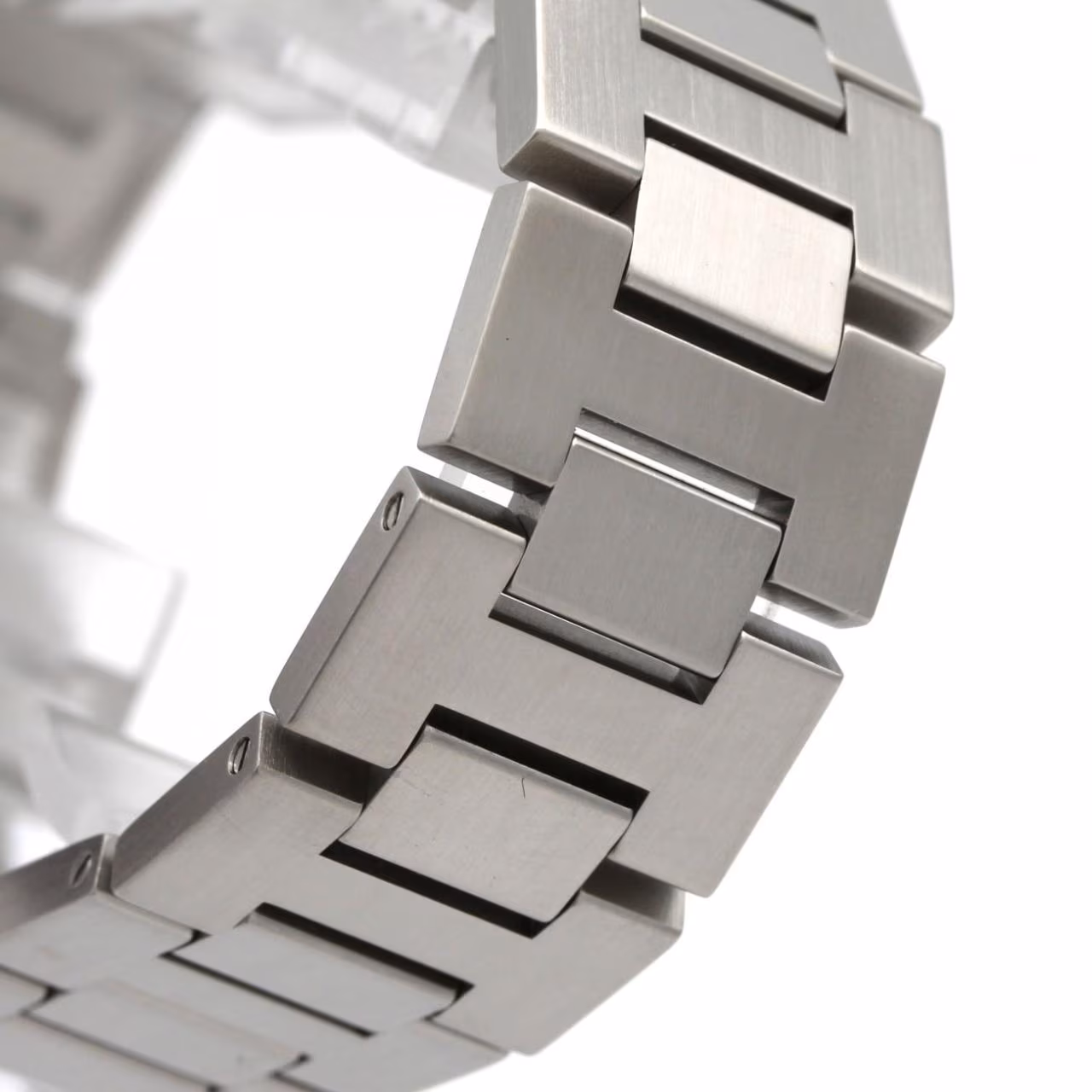 Round steel automatic watch with screw-down crown cover and steel bracelet.