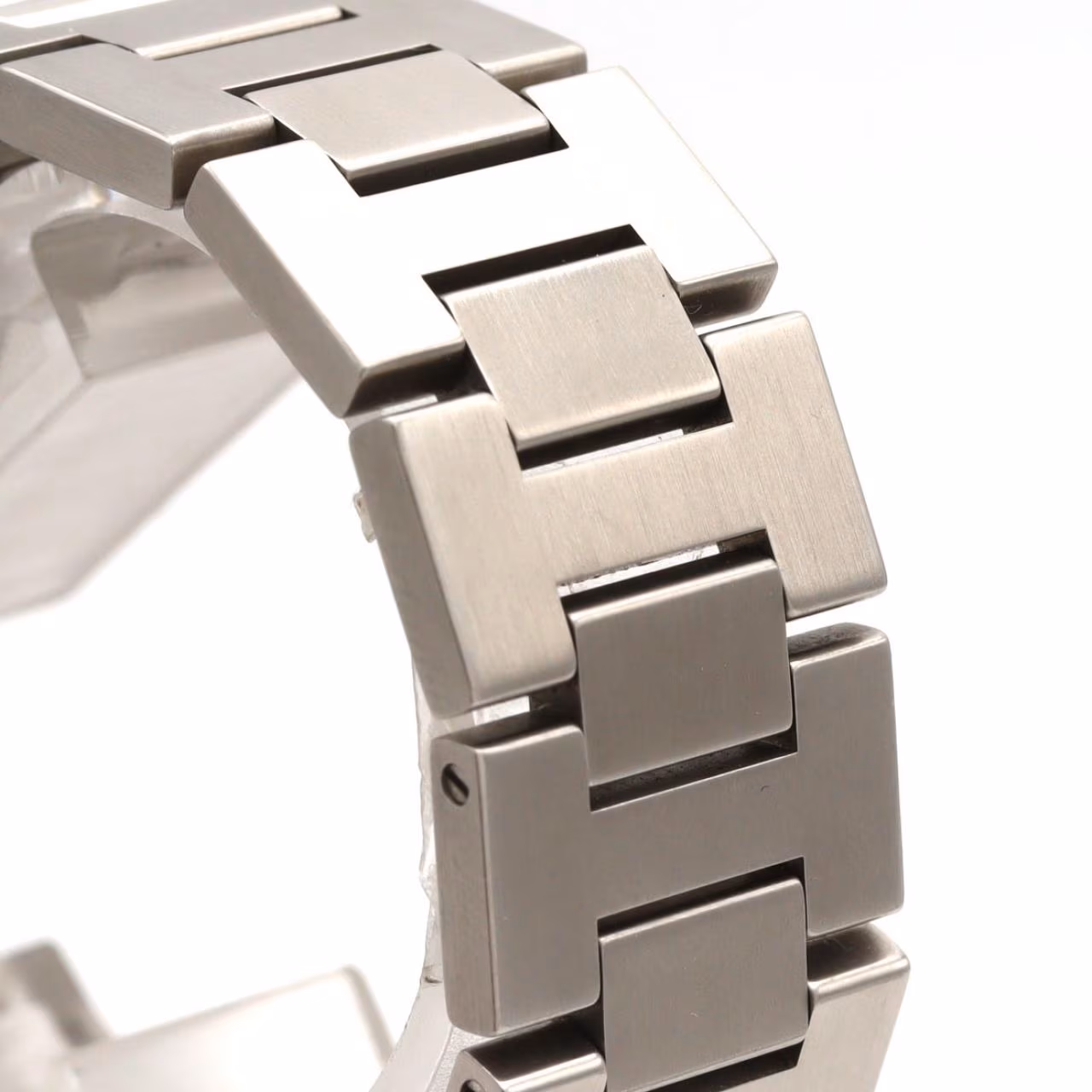 Round steel wristwatch with Arabic numeral dial and integrated steel bracelet.