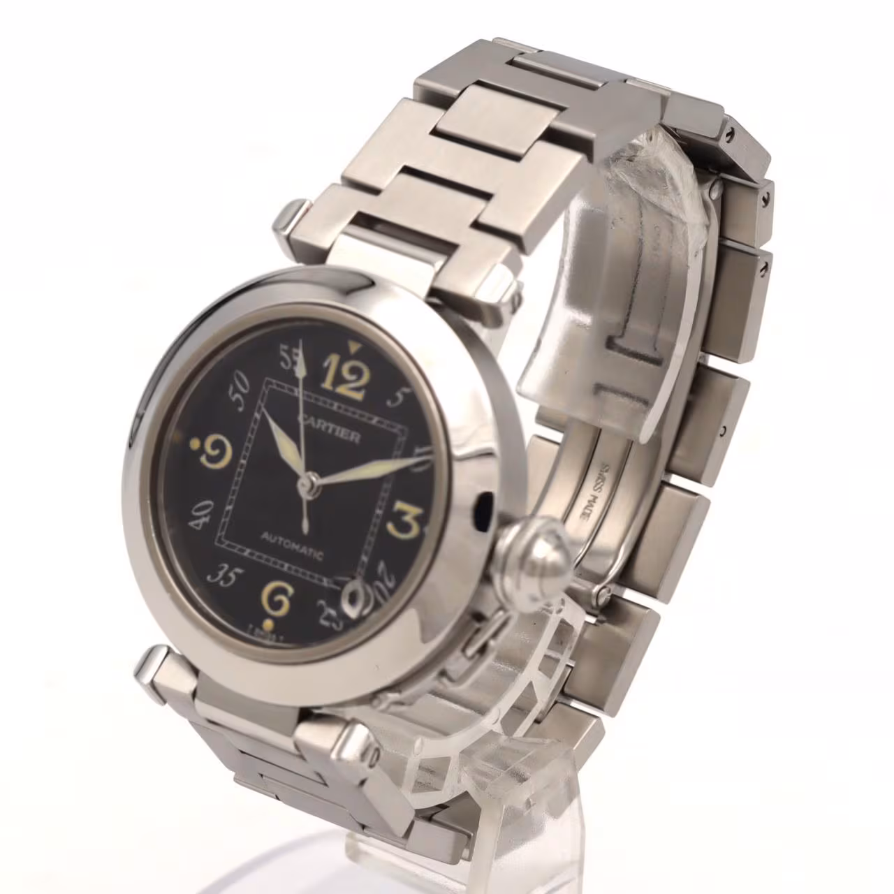 Round steel watch with a screw-down crown cap on a steel bracelet.