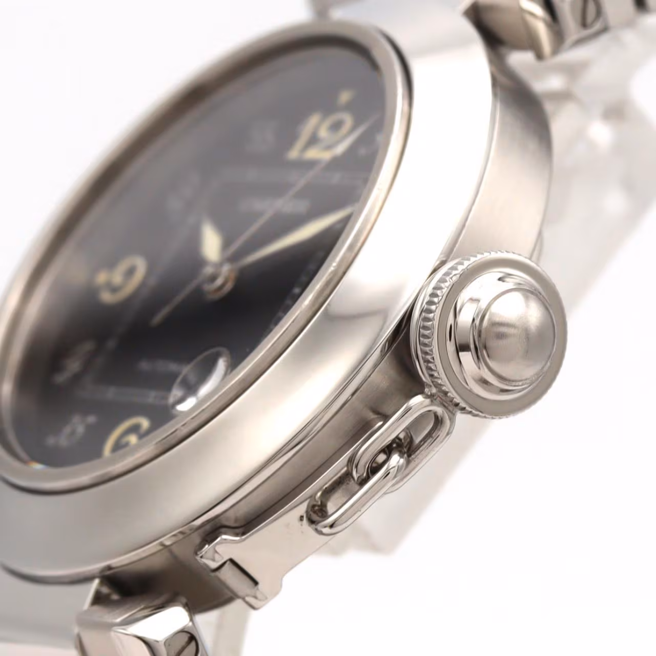 Round steel watch with a screw-down crown cap on a steel bracelet.