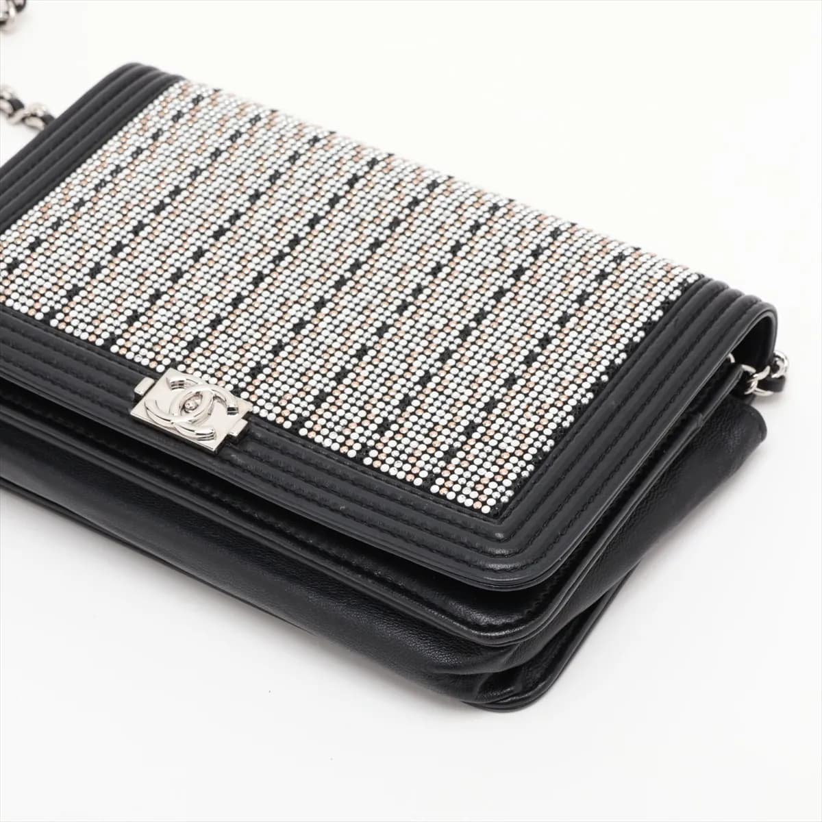 Black quilted leather flap wallet with a wide silver-tone clasp and chain strap.