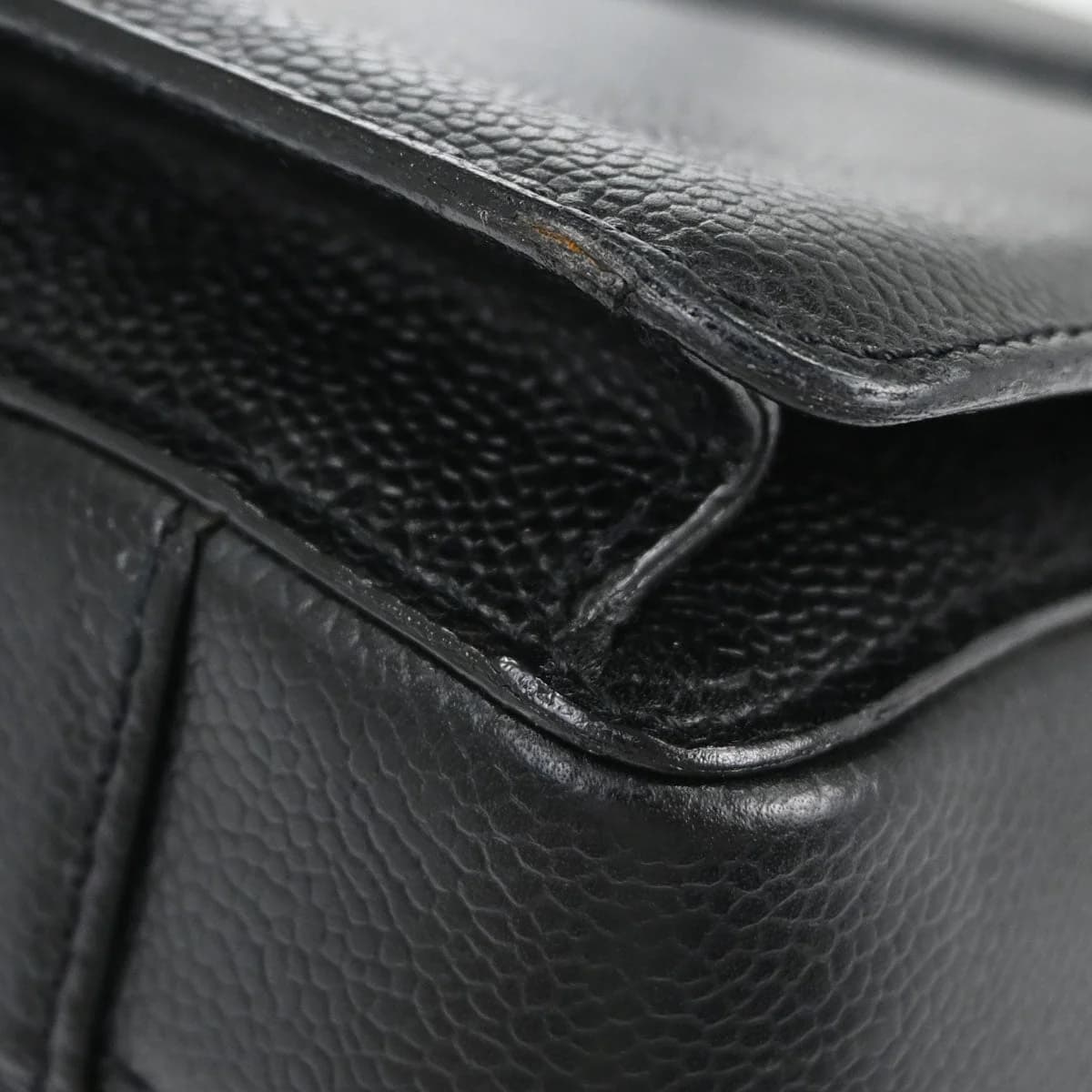 Structured black grained leather briefcase with top handles and gold-tone hardware