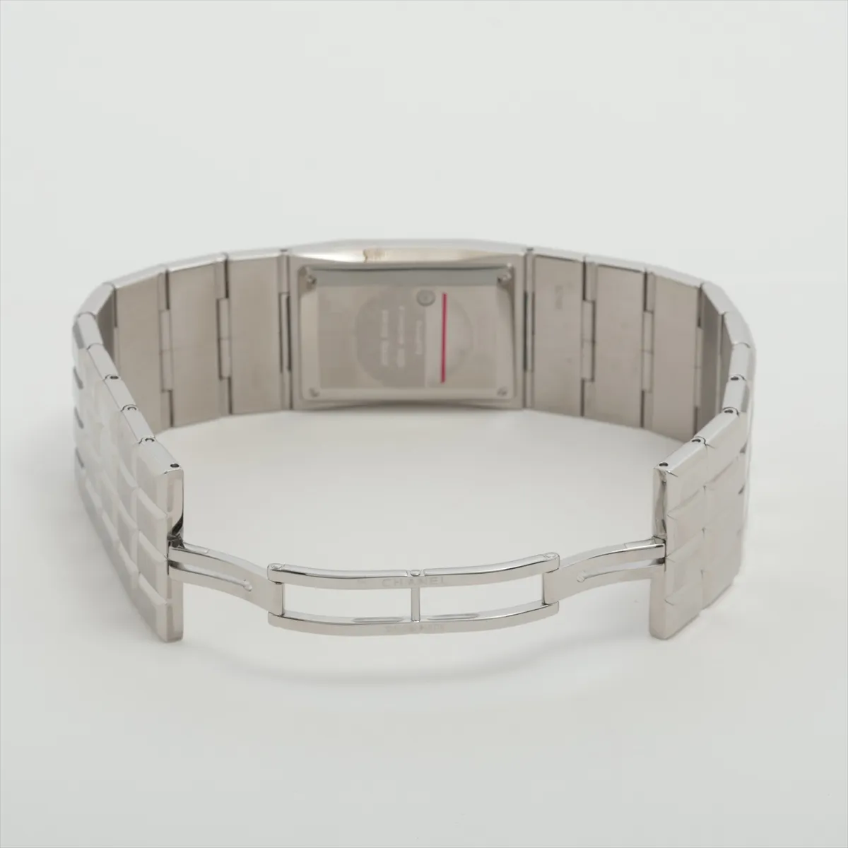 Slim rectangular stainless steel watch with digital display and integrated steel bracelet.