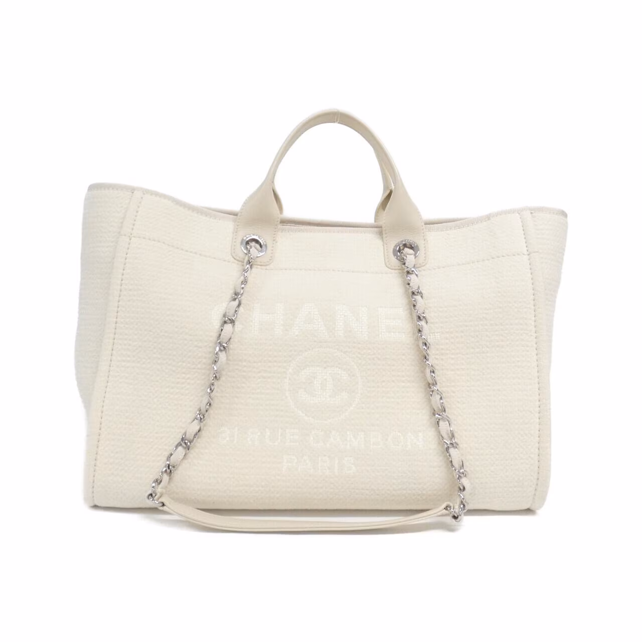 Tote bag with woven handles and a large logo on the front.