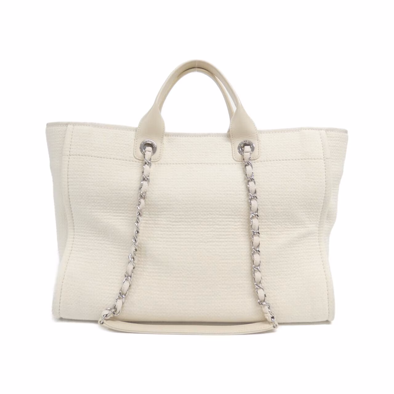 Tote bag with woven handles and a large logo on the front.