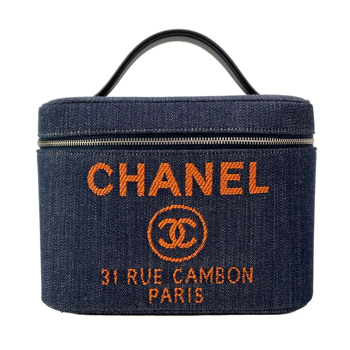Navy structured vanity bag with top handles.