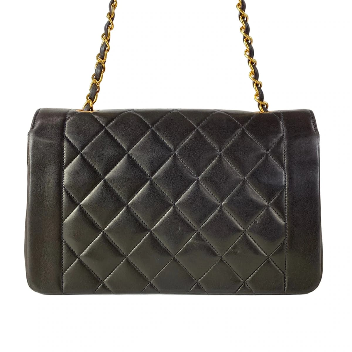 Quilted black flap bag with a turnlock closure and a thin chain-and-leather shoulder strap.