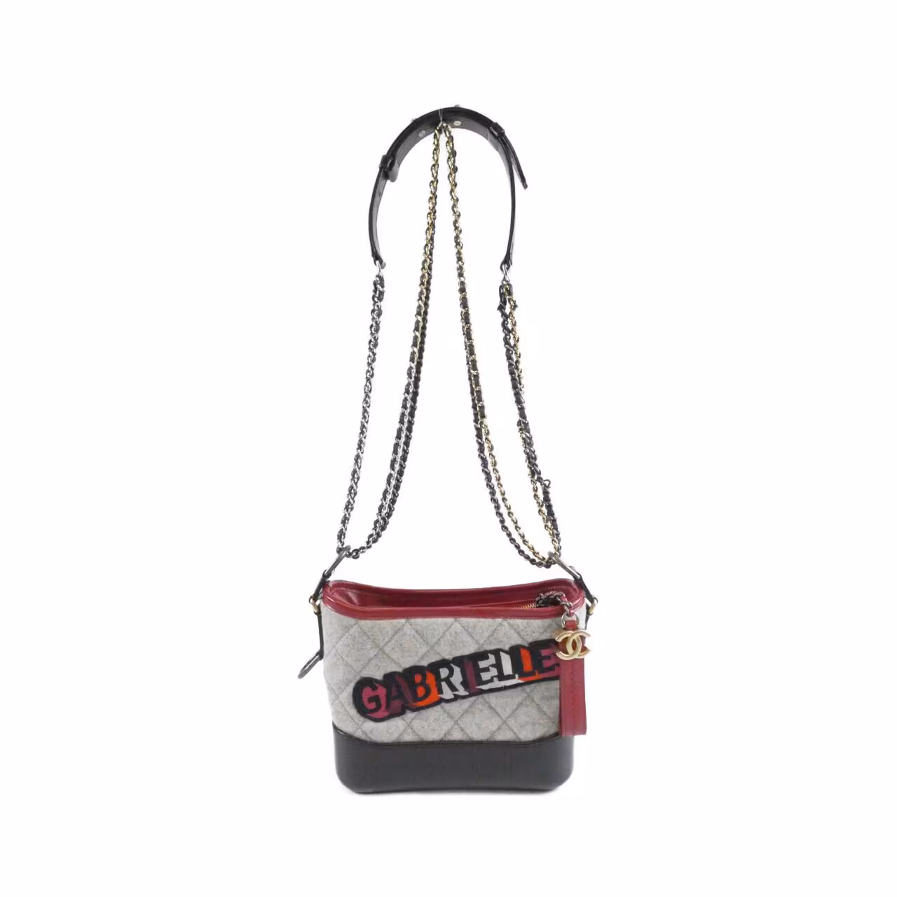 Quilted shoulder bag with a rounded body and mixed-metal chain strap.