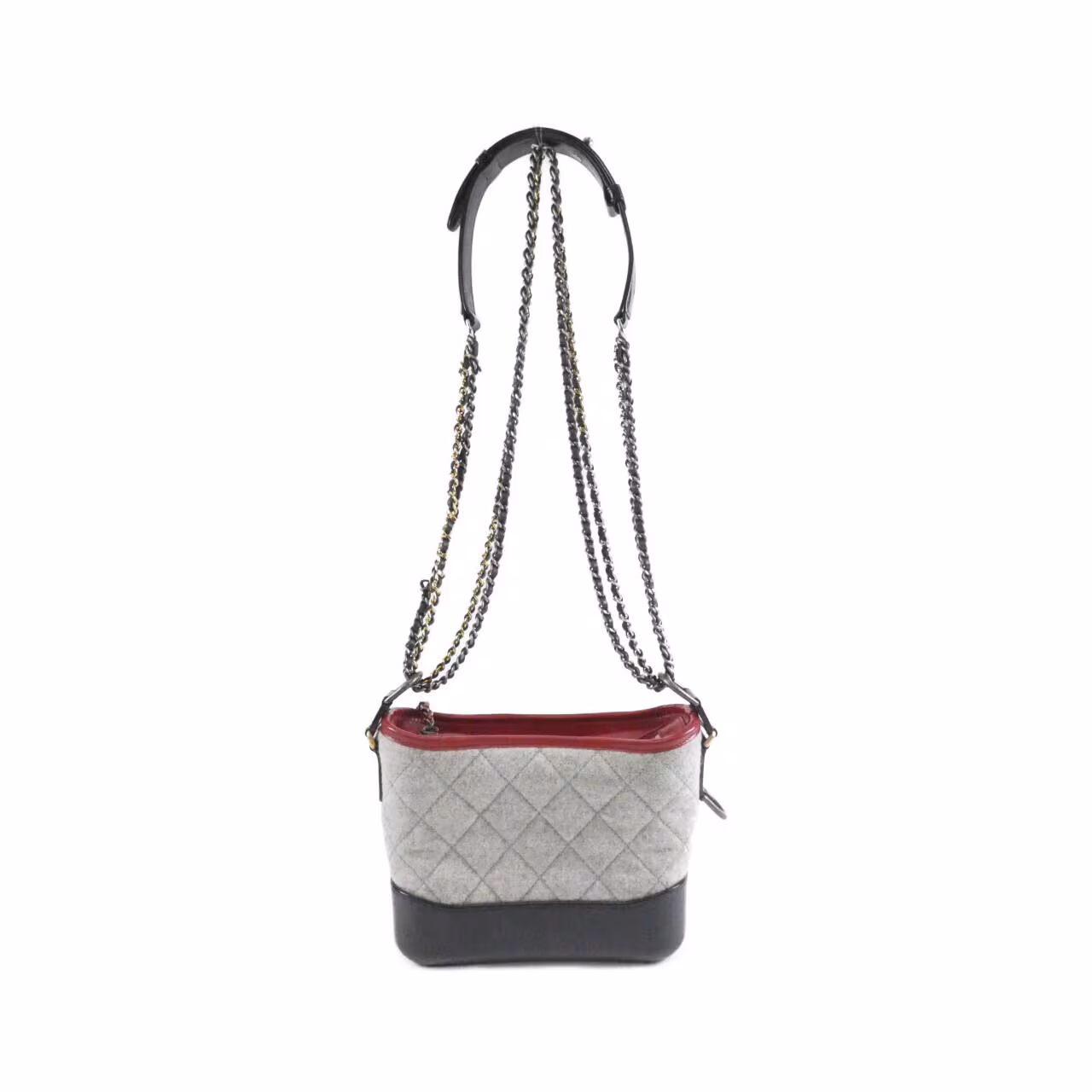 Quilted shoulder bag with a rounded body and mixed-metal chain strap.