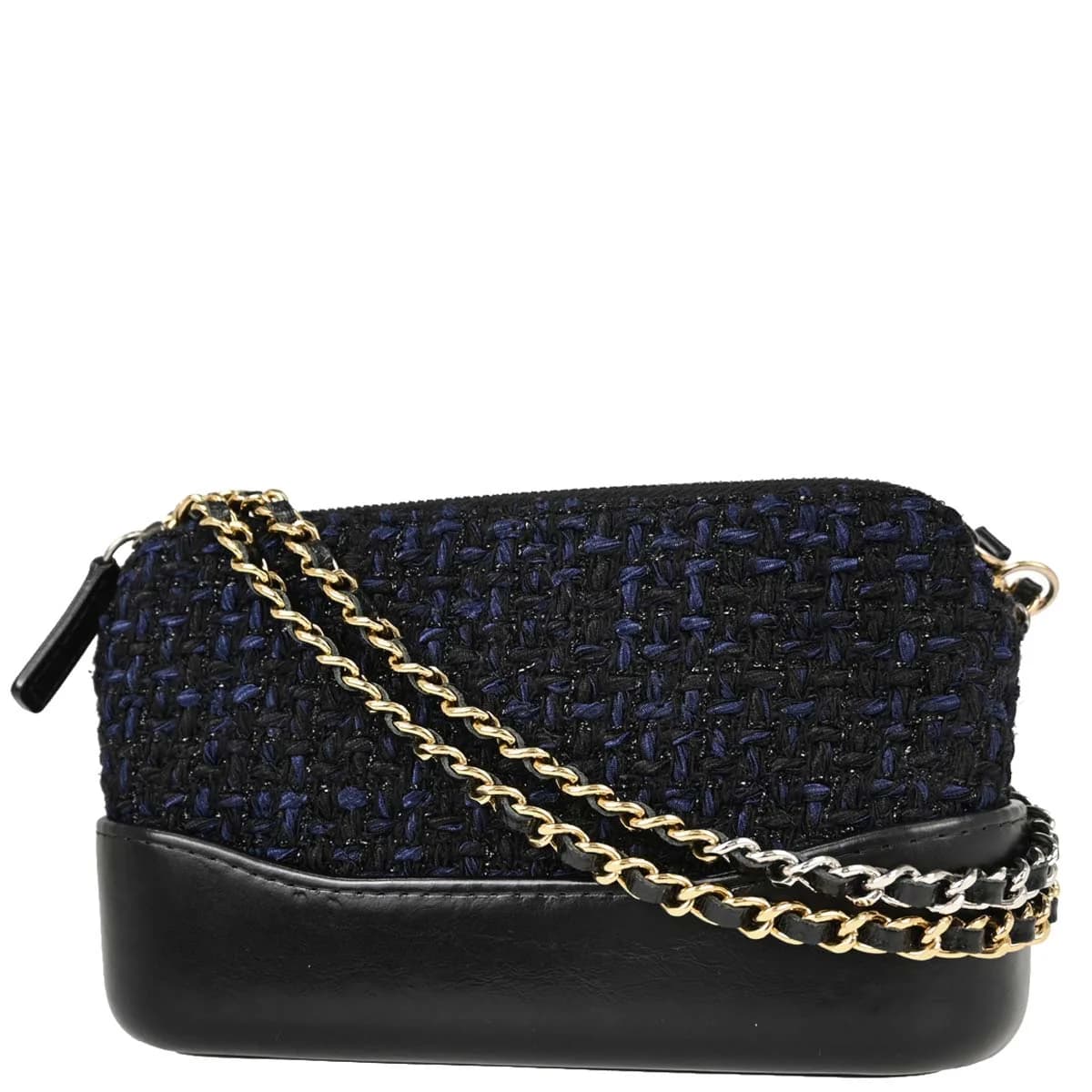 Small quilted navy tweed flap bag with a chain-and-leather shoulder strap.