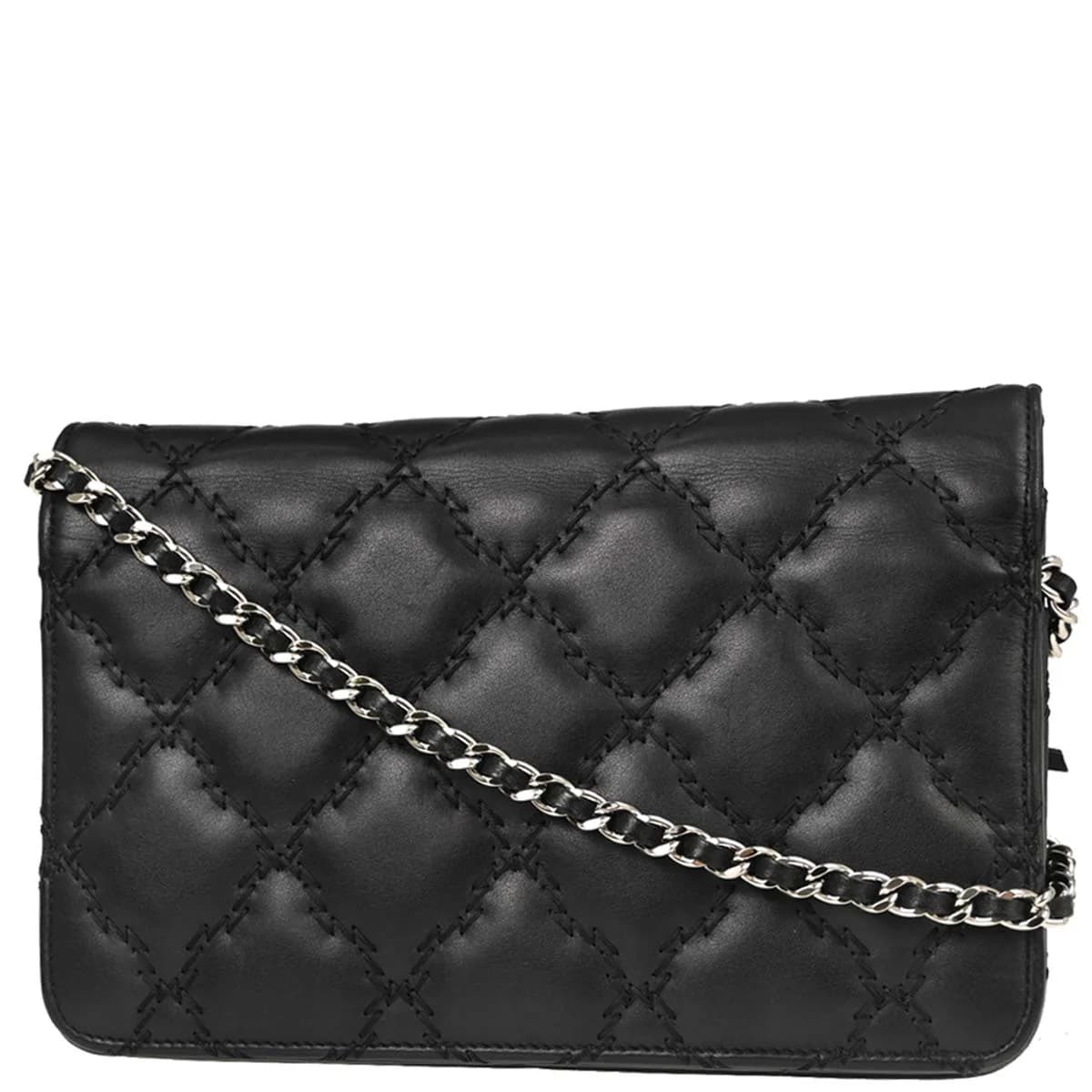 Small black leather flap bag on a chain strap, quilted front with turnlock closure.