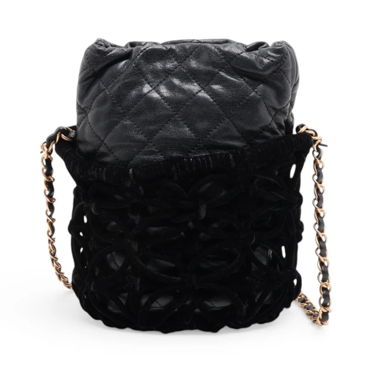 Black quilted drawstring bag with a gold chain strap and soft velour panels.