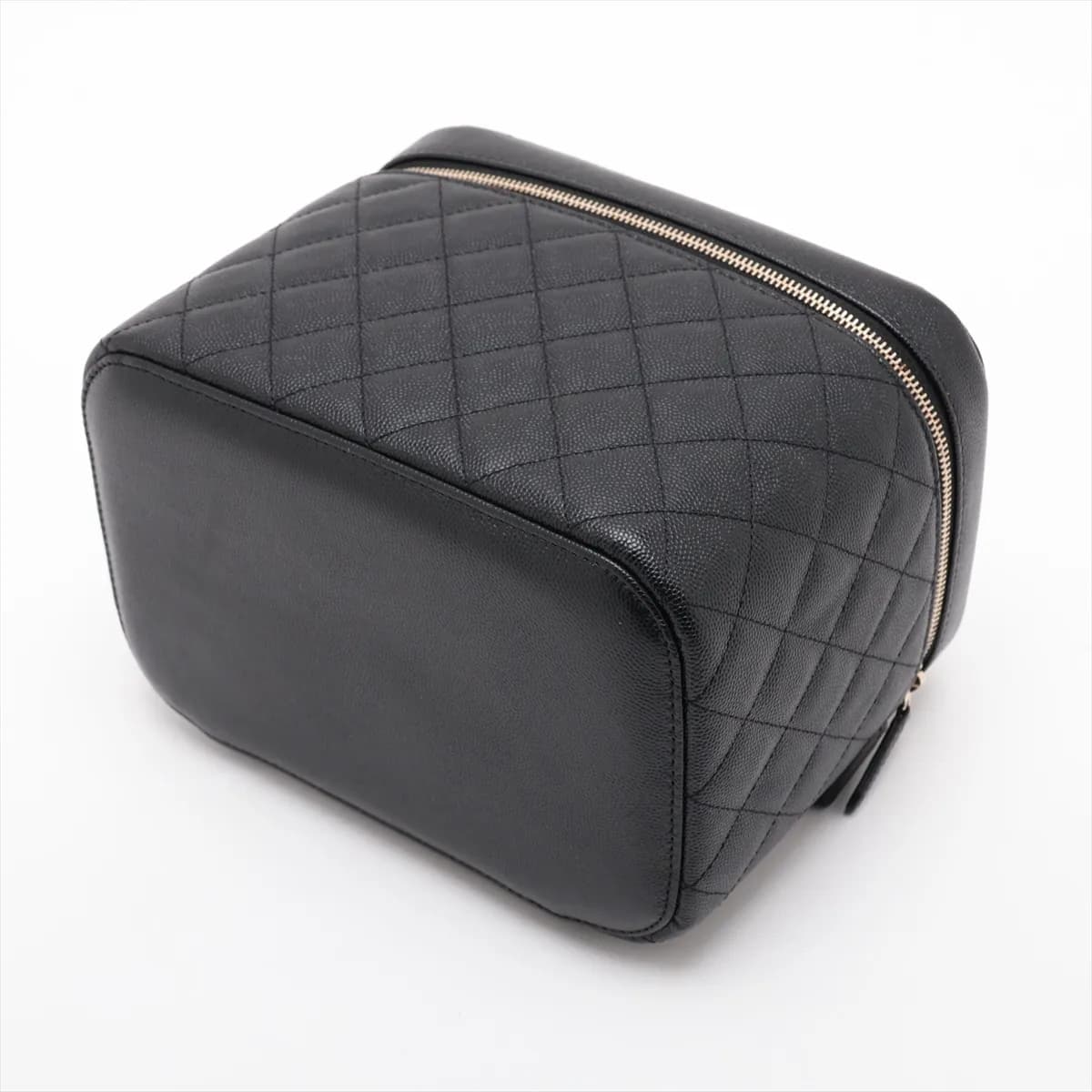 Black quilted caviar leather vanity case with a top handle and gold-tone hardware.