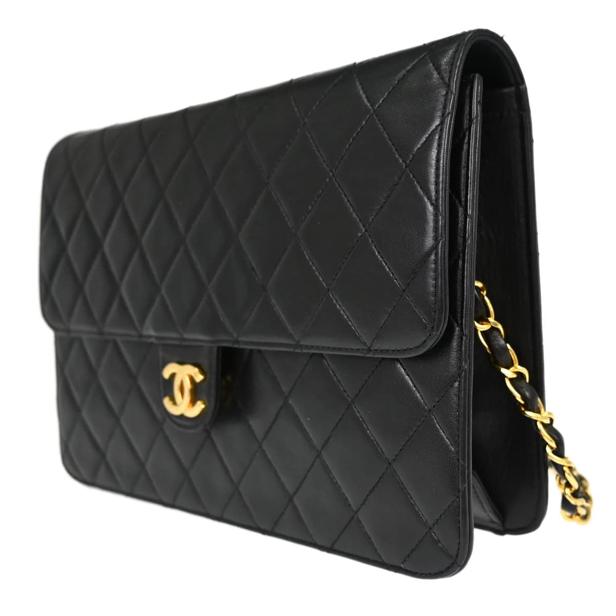 Black quilted leather flap bag with chain shoulder strap and square turnlock on the flap