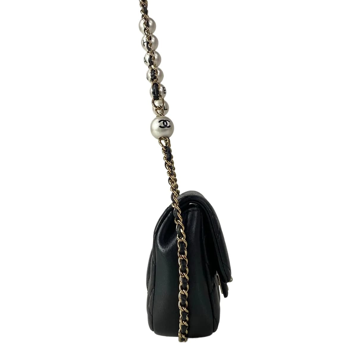 Small black quilted leather bag with a chain strap.