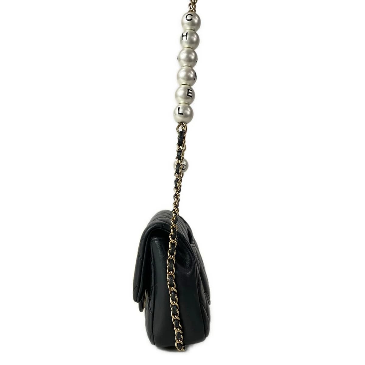 Small black quilted leather bag with a chain strap.