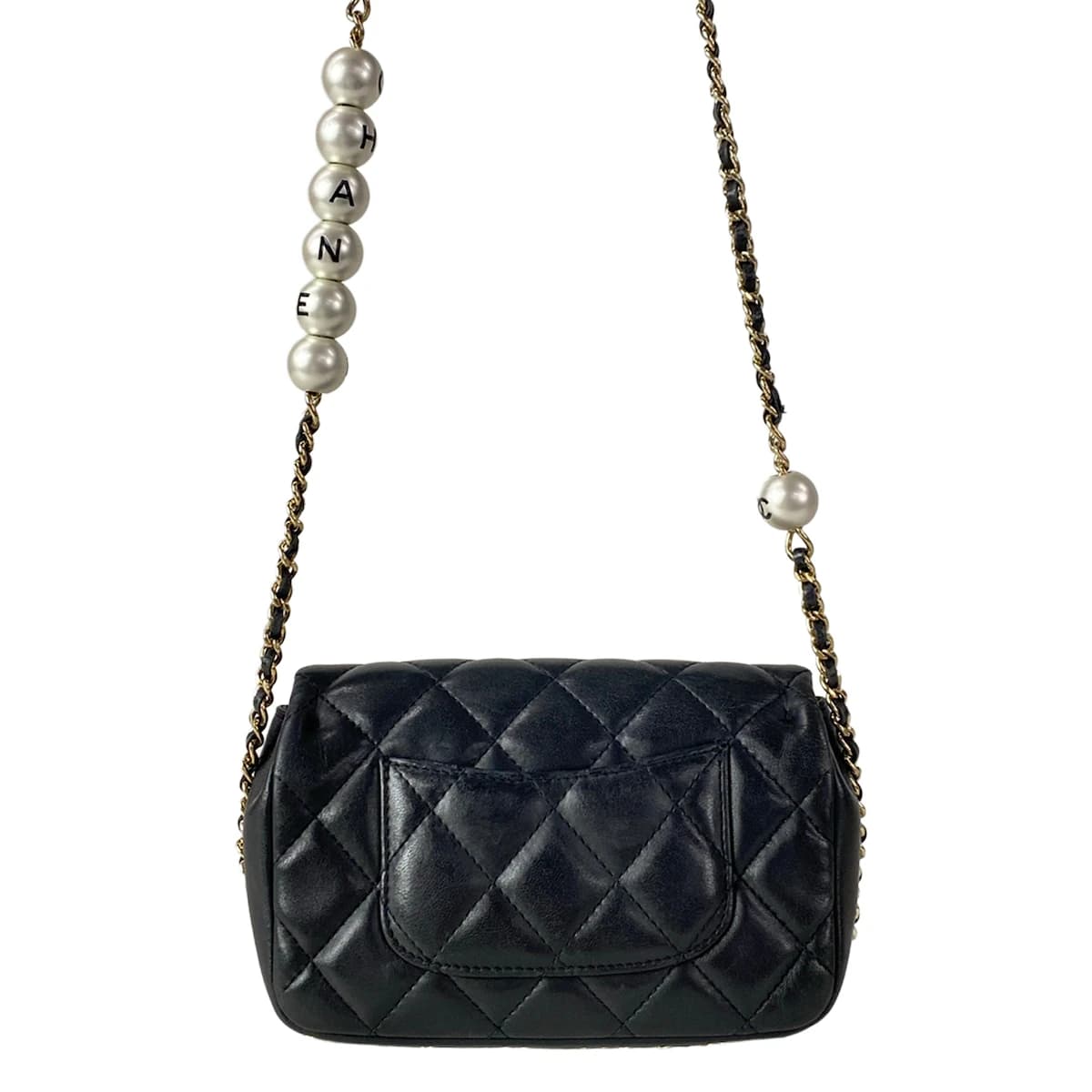 Small black quilted leather bag with a chain strap.