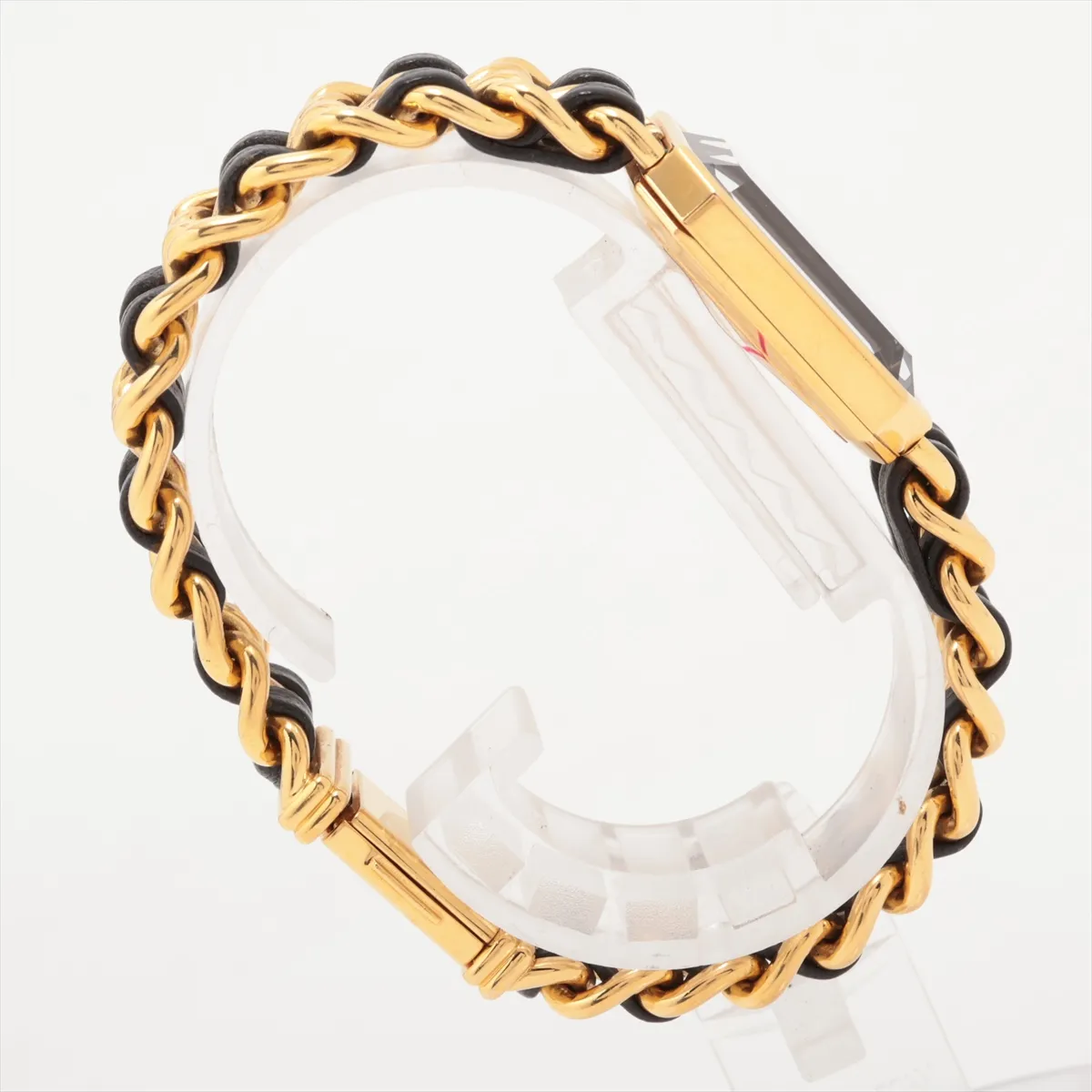 Gold-toned octagonal watch with black dial on a dark leather strap.