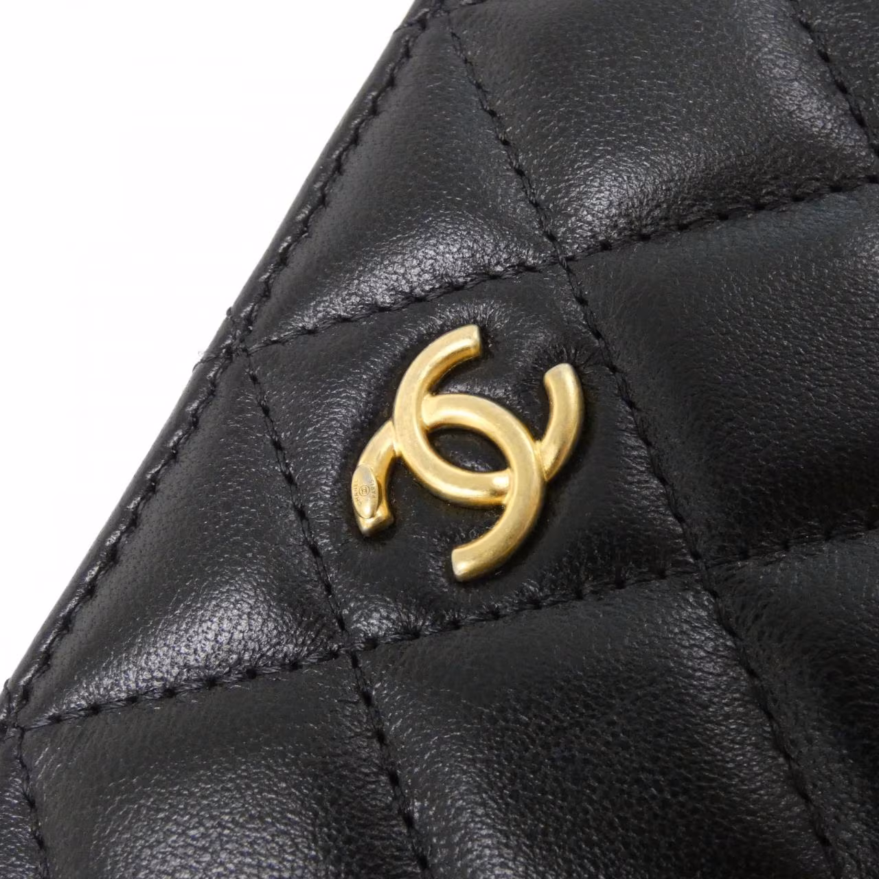 Shoulder bag with a chain strap photographed against a plain background.