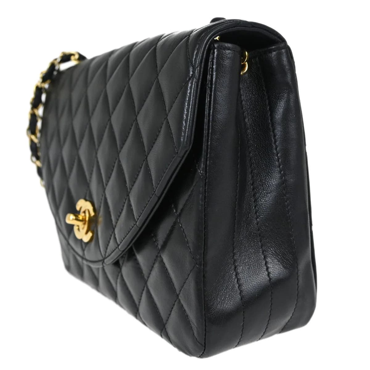 Black quilted lambskin flap bag with interwoven chain-and-leather strap and a logo clasp