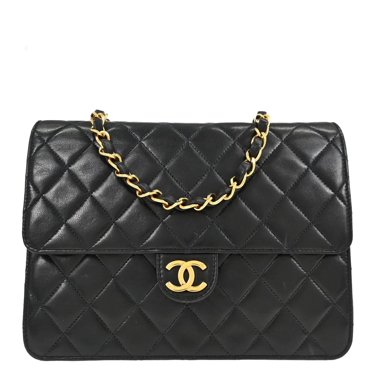 Black quilted leather flap bag with a chain and leather shoulder strap and a turnlock closure