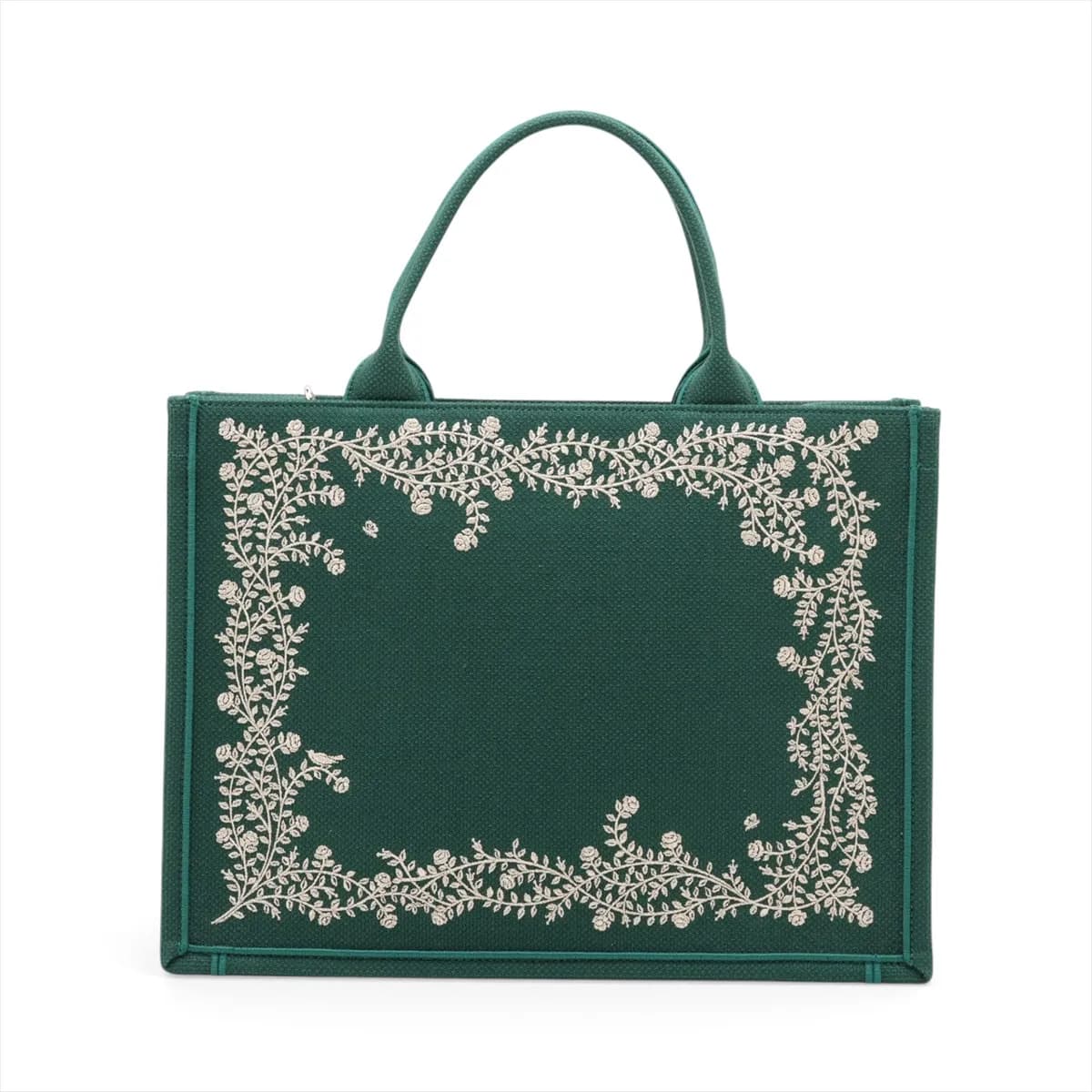 Green patterned canvas tote with star motifs, flat handles and detachable strap.