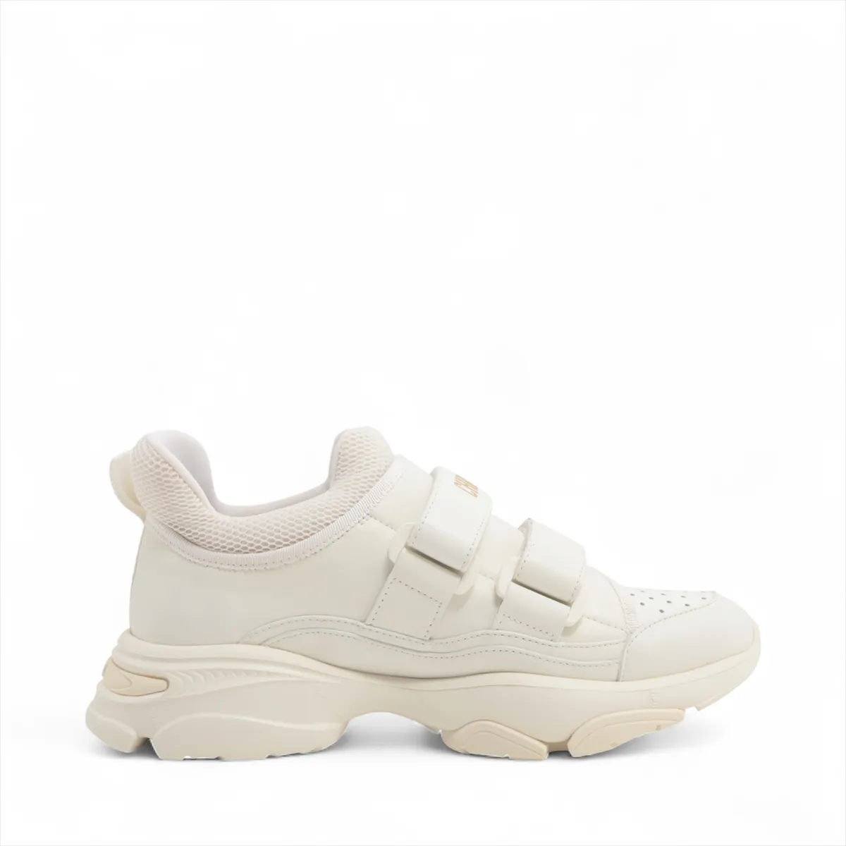 White sneakers with chunky ridged soles, photographed side on