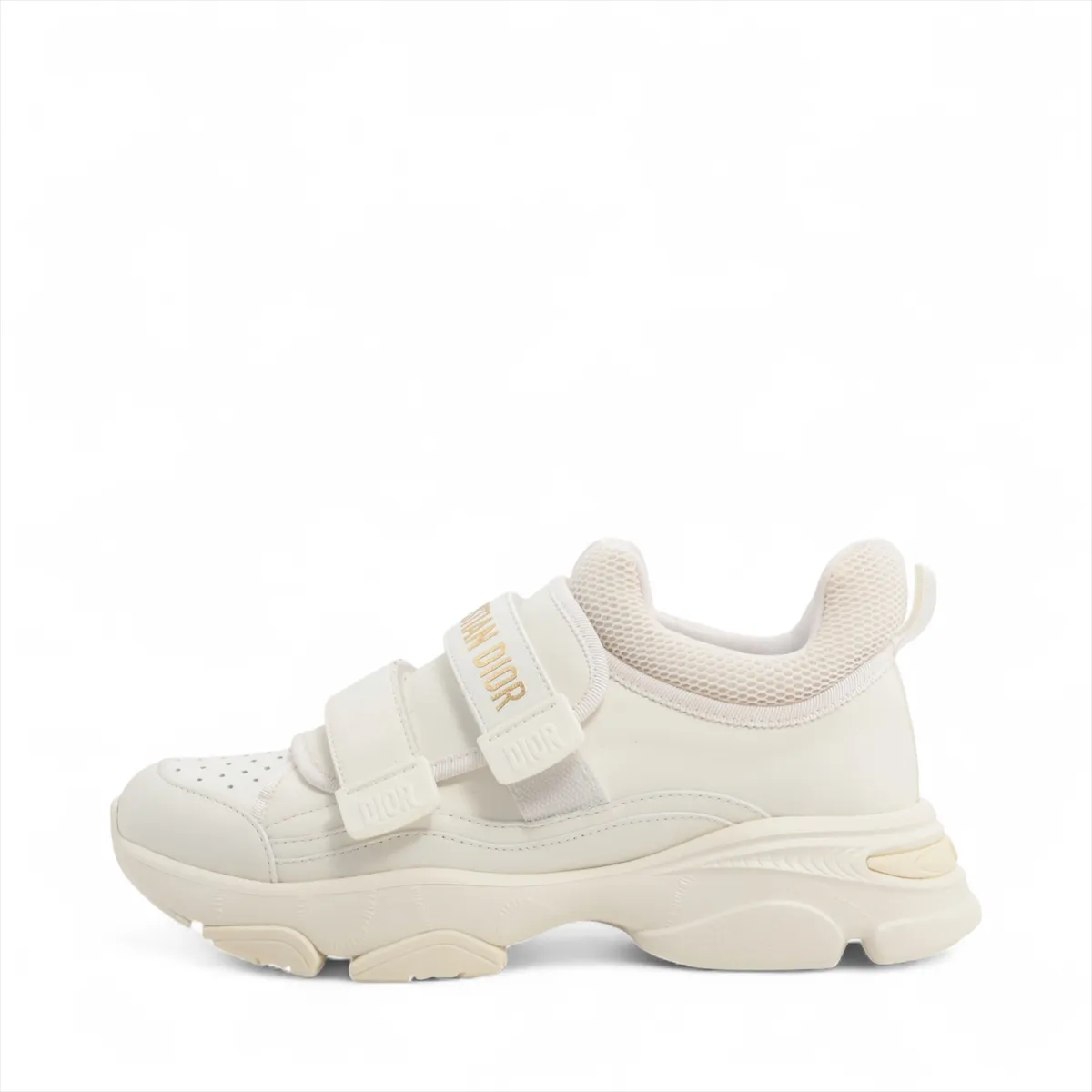 White sneakers with chunky ridged soles, photographed side on