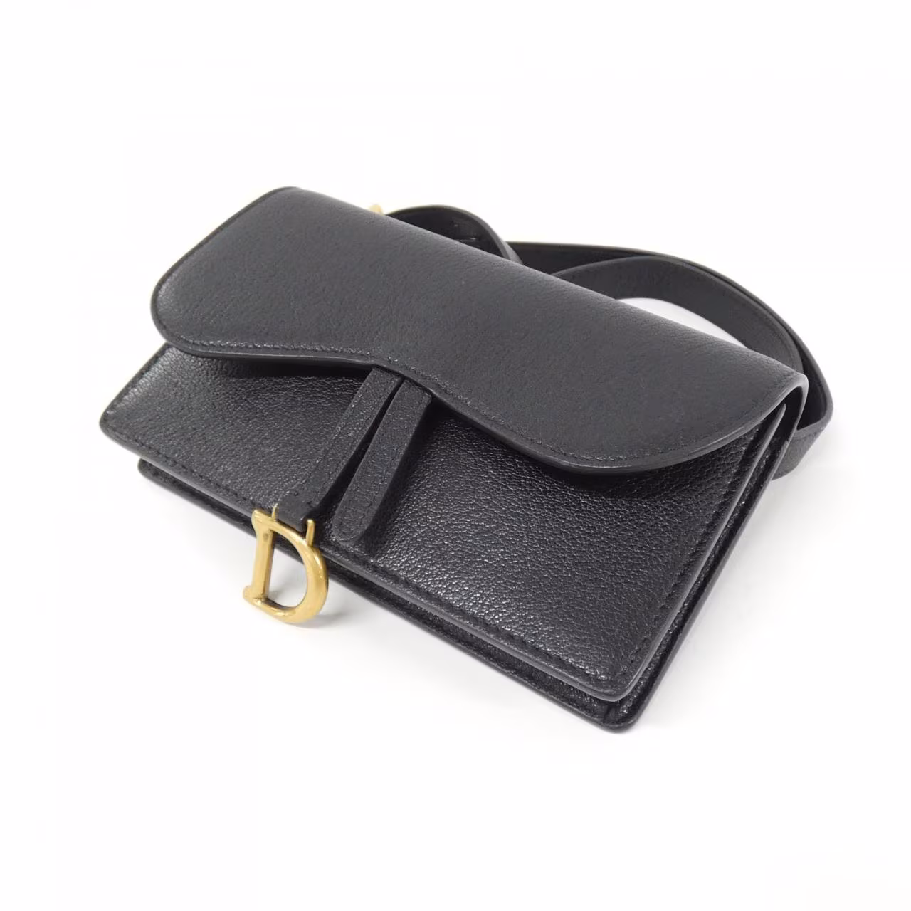 Saddle-shaped pouch with a curved flap and a belt loop at the back.
